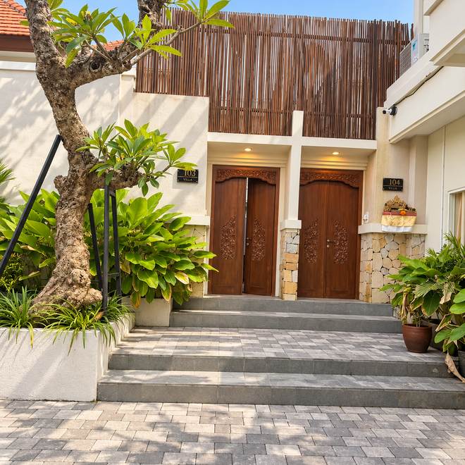 Timber entrance doors and stone path