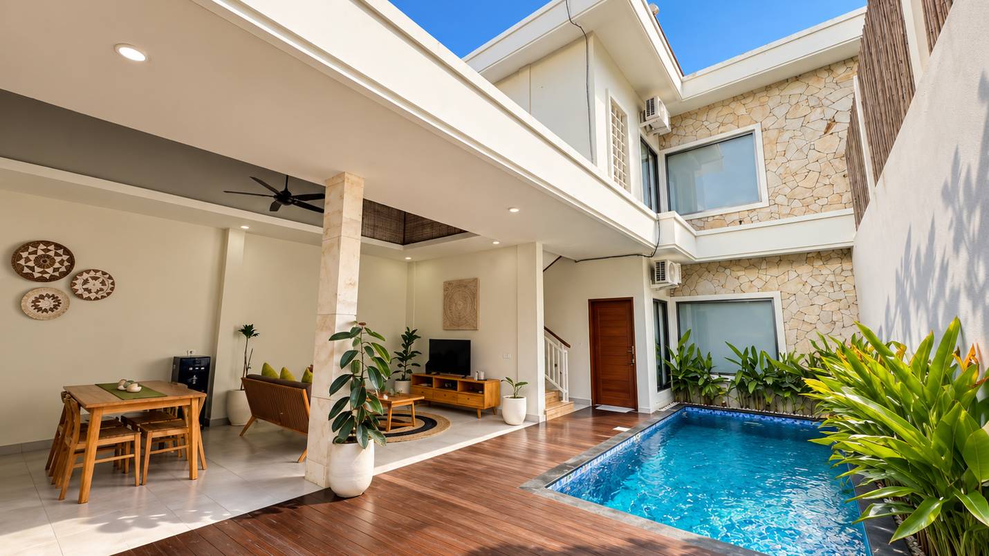 Living room opening onto the private pool at Puti Villas