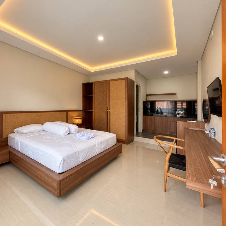 Studio room with bed, desk and wardrobe
