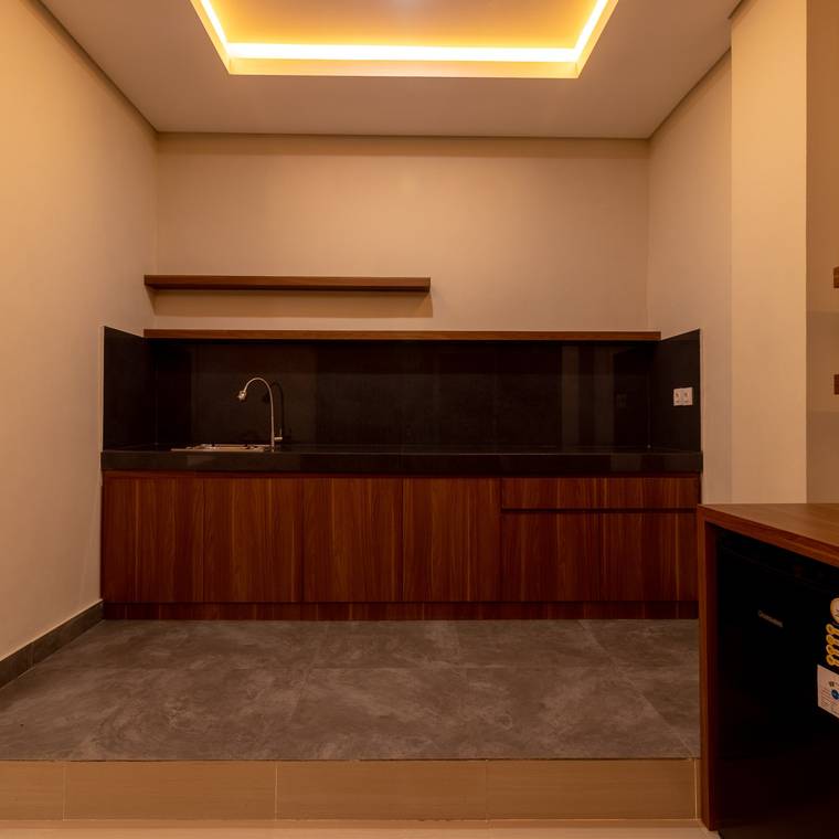 Kitchenette with sink and stone counter