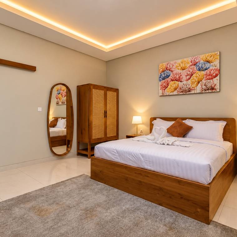 Second bedroom with artwork and bedside lamps